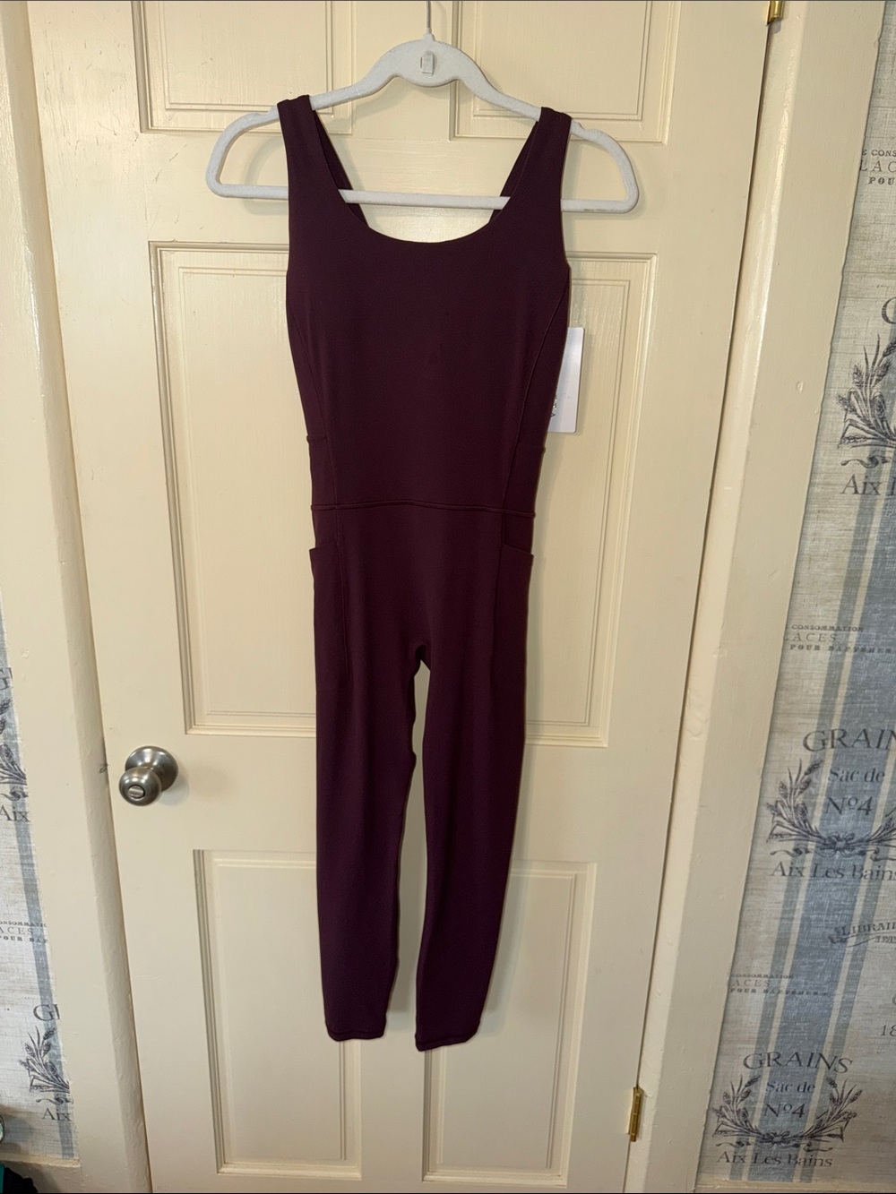Athleta Salutation Bodysuit Sleeveless Scoop-Neck Jumpsuit in Plum